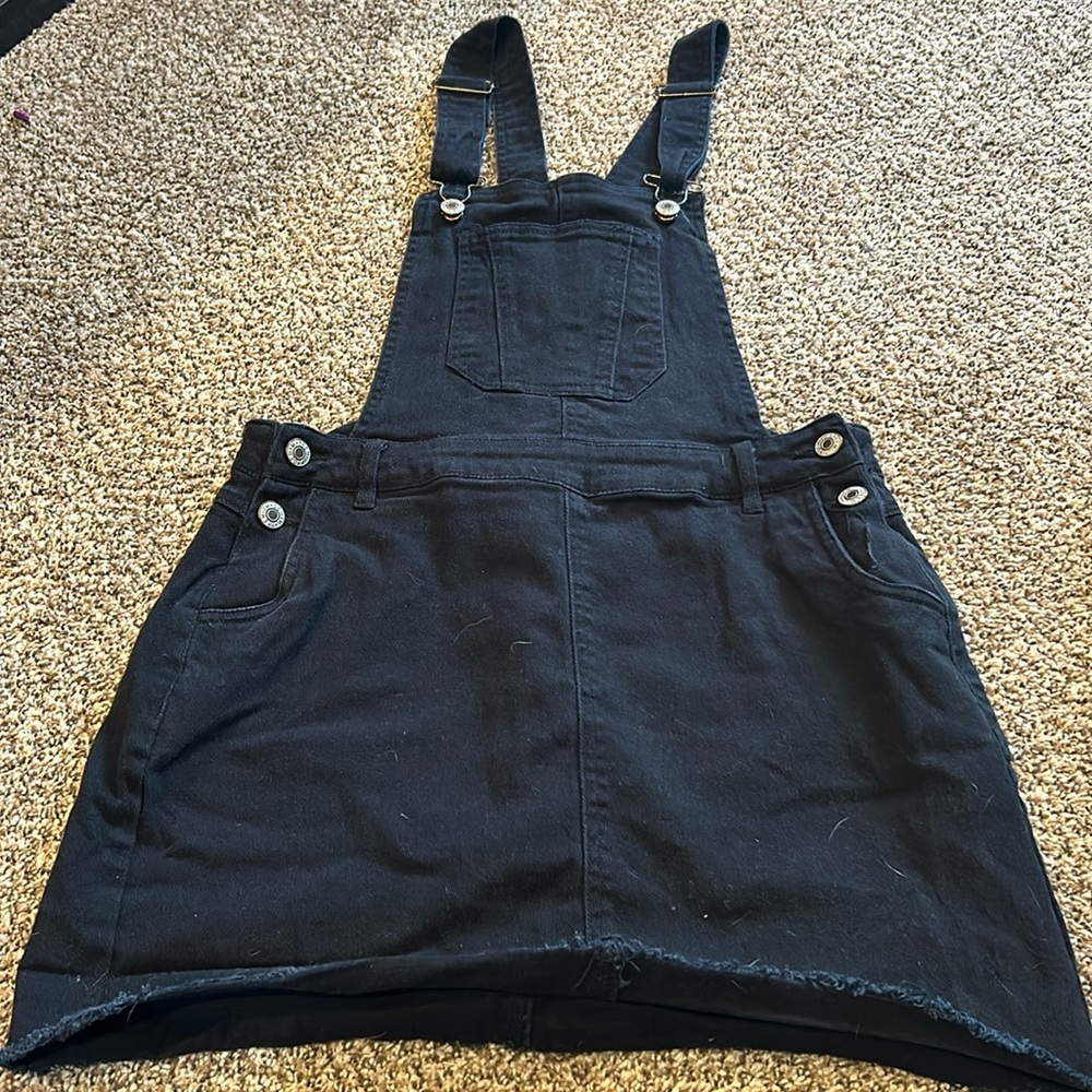 Super cute black denim skirt overalls.